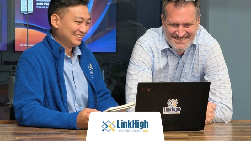Two coworkers from Link High exploring the top tech companies in New Jersey on a laptop.